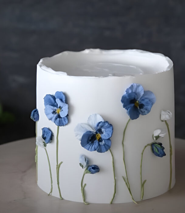 Elegant White Cake with Blue Flowers