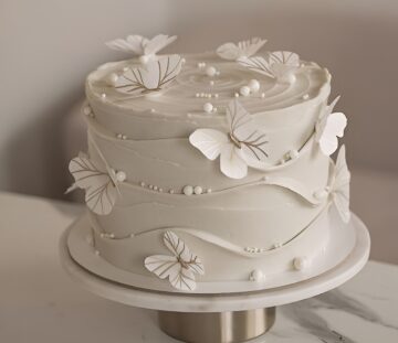 Elegant white on white butterfly cake